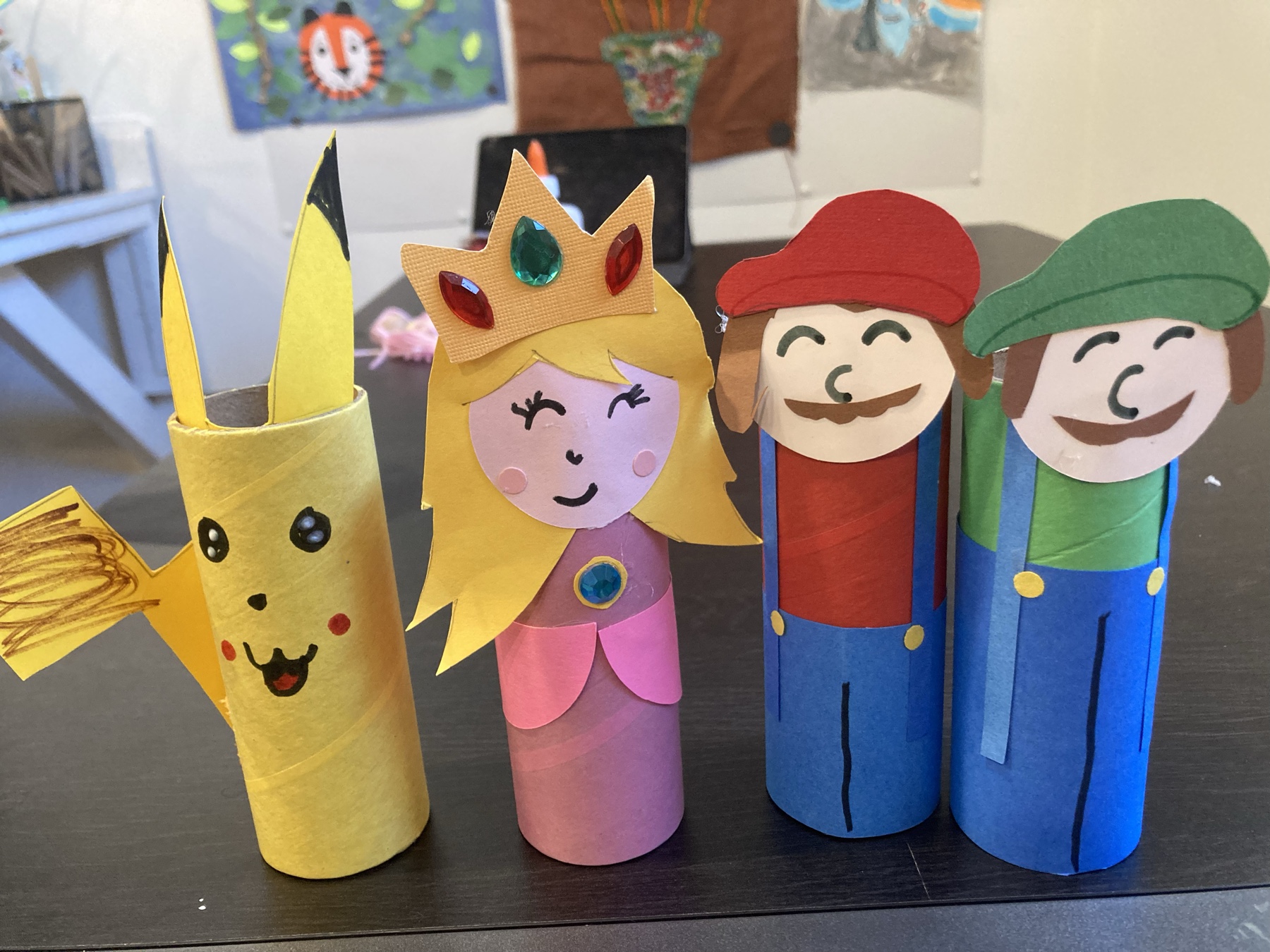 Colorful handmade paper characters created at Little Beasties